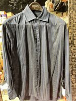 Full view of front of dress shirt on hanger