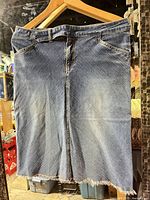 Front view of denim skirt on hanger
