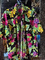 Front view of floral Hawaiian shirt on hanger