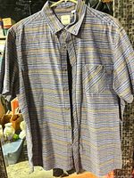 Front view of shirt hanging to show full style and pattern