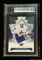 Front of graded Auston Matthews die-cut card showing player image, Upper Deck and KSA 8.5 label