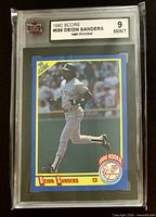 Front view of graded Deion Sanders 1990 Score rookie card showing grade label