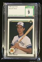 Front of encapsulated 1990 Upper Deck John Olerud rookie card with CSG grade label