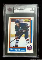 Front of graded Mike Bossy O-Pee-Chee card showing player image and KSA 8 NMM label