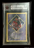 Front view of KSA-slabbed Leaf Gold Leaf Stars card showing Scott Stevens side and grade label