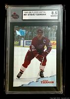 Front of graded 1995-96 Fleer Metal #51 Steve Yzerman card in KSA slab showing grade 8.5 NMM+