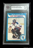 Front of graded Wayne Thomas card in KSA slab showing grade 7.5 NM+ label