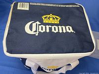 Top view of navy and white Corona soft cooler with zipper lid
