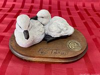 Top view of ducklings sculpture showing Ducks Unlimited medallion and signature