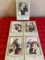 Slipcase with four DVD cases arranged on table