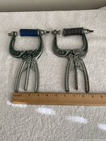 Both plier clamps beside ruler showing size and features