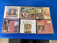 Front view of six sealed Reader's Digest CD box sets