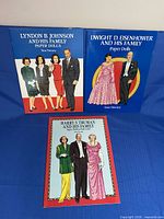 Front covers of all three paper doll books