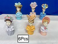 Front view of all six Victorian Lady thimbles
