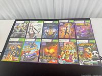 All 10 Xbox 360 game cases laid out, front covers visible