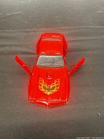 Top angle showing full car and open doors
