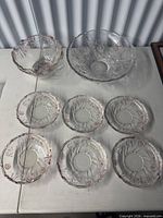 Top view of entire set showing one large bowl, one medium bowl, six small plates