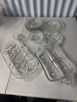 Group view of all pressed glass items on table