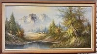 Full view of framed landscape painting showing scene and frame