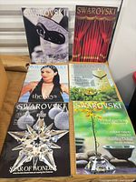 Six Swarovski magazines laid out showing each cover