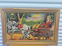Full view of framed needlepoint tapestry