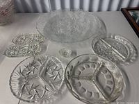 Group shot showing all six glass and crystal serving pieces