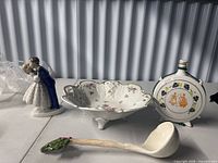 Group view showing figurine, bowl, flask and ladle