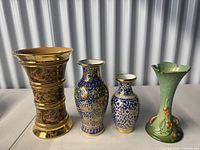 All four vases grouped for overall view