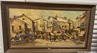 Full view of framed oil painting showing entire Mediterranean street scene