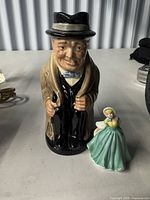 Front view of both Royal Doulton pieces for scale and detail