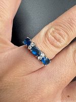 Top view showing arrangement of blue and clear stones on ring