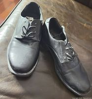 Top view of both shoes showing leather uppers and laces