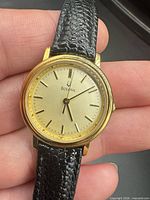 Front view showing dial, case, and strap