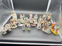All 18 ceramic figurines arranged together