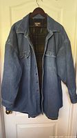 Front view of Montana Blue denim jacket hanging on hanger