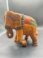 left side profile showing carved and painted details