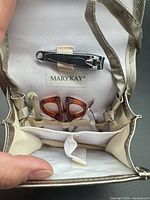 Open case showing interior layout and all grooming tools