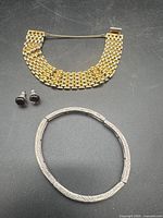 All three jewellery pieces laid out