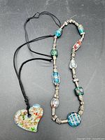 Both necklaces laid out