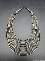 Full view of necklace showing all strands and overall design