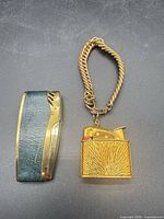 Both lighters side by side showing overall design and chain