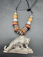 Full view of necklace showing leopard pendant and bead arrangement
