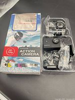 Retail box and contents overview showing camera, housing and accessories