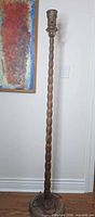 Full view of carved wooden floor lamp