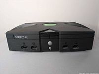 Front view showing Xbox logo, power button and four controller ports