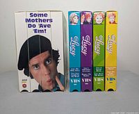 Boxed set of Some Mothers Do ’Ave ’Em! and four The Lucy Show VHS tapes side by side