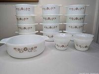 Full set showing casserole dish, two ramekins, and stacked soup bowls with pattern visible