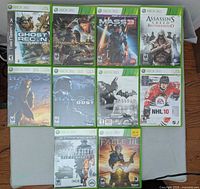 Front view of all ten Xbox 360 game cases