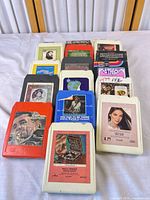Group of 16 assorted 8-track tapes laid out in rows