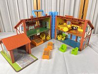 Overall view of house opened with garage, elevator and furniture pieces